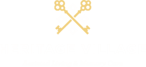 Heritage Village logo featuring two golden keys crossed above the title text.