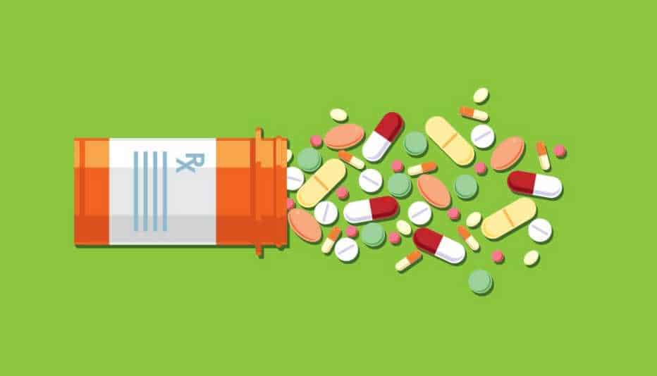 Prescription bottle with various pills spilling out on a green background.